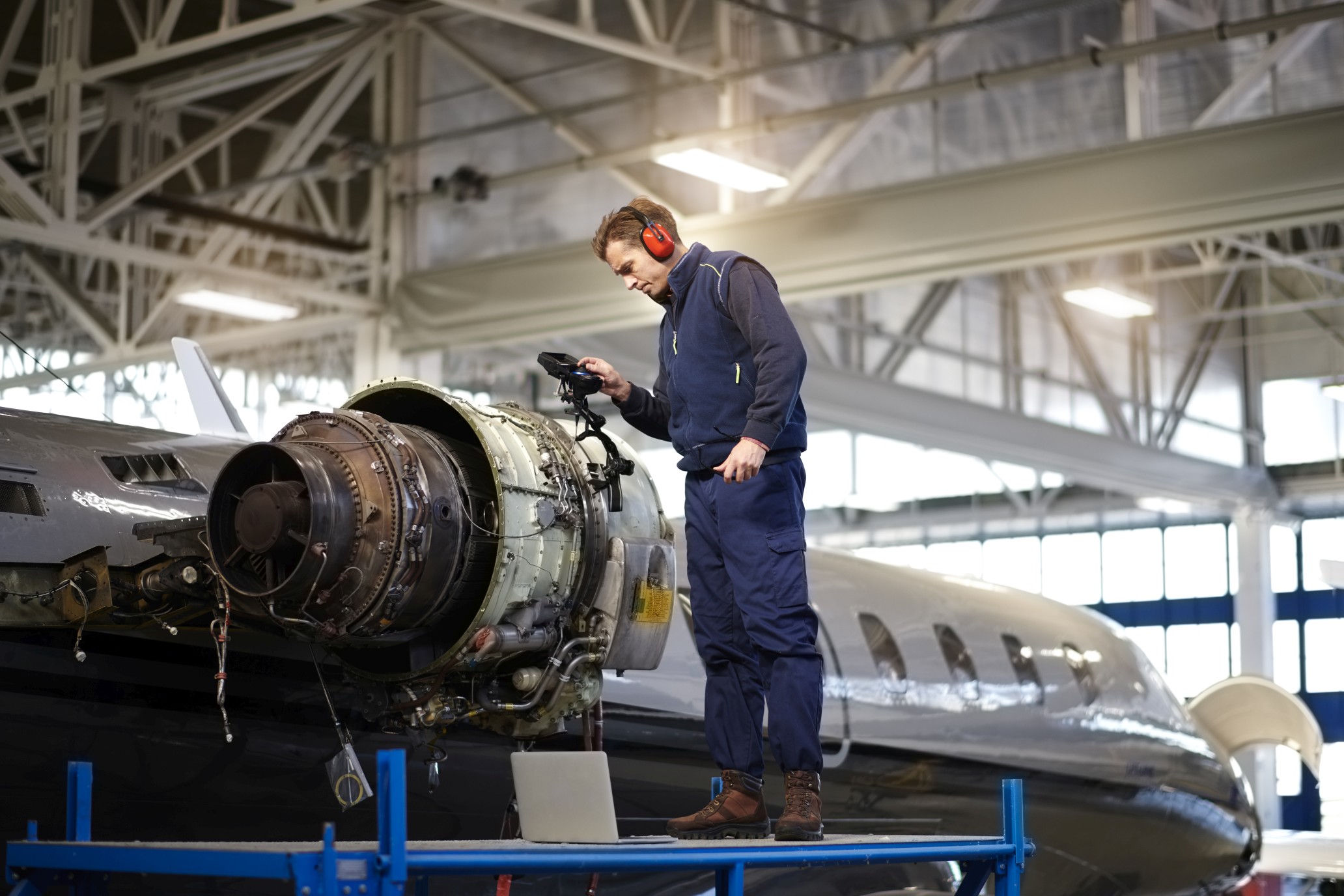Man working on a plane